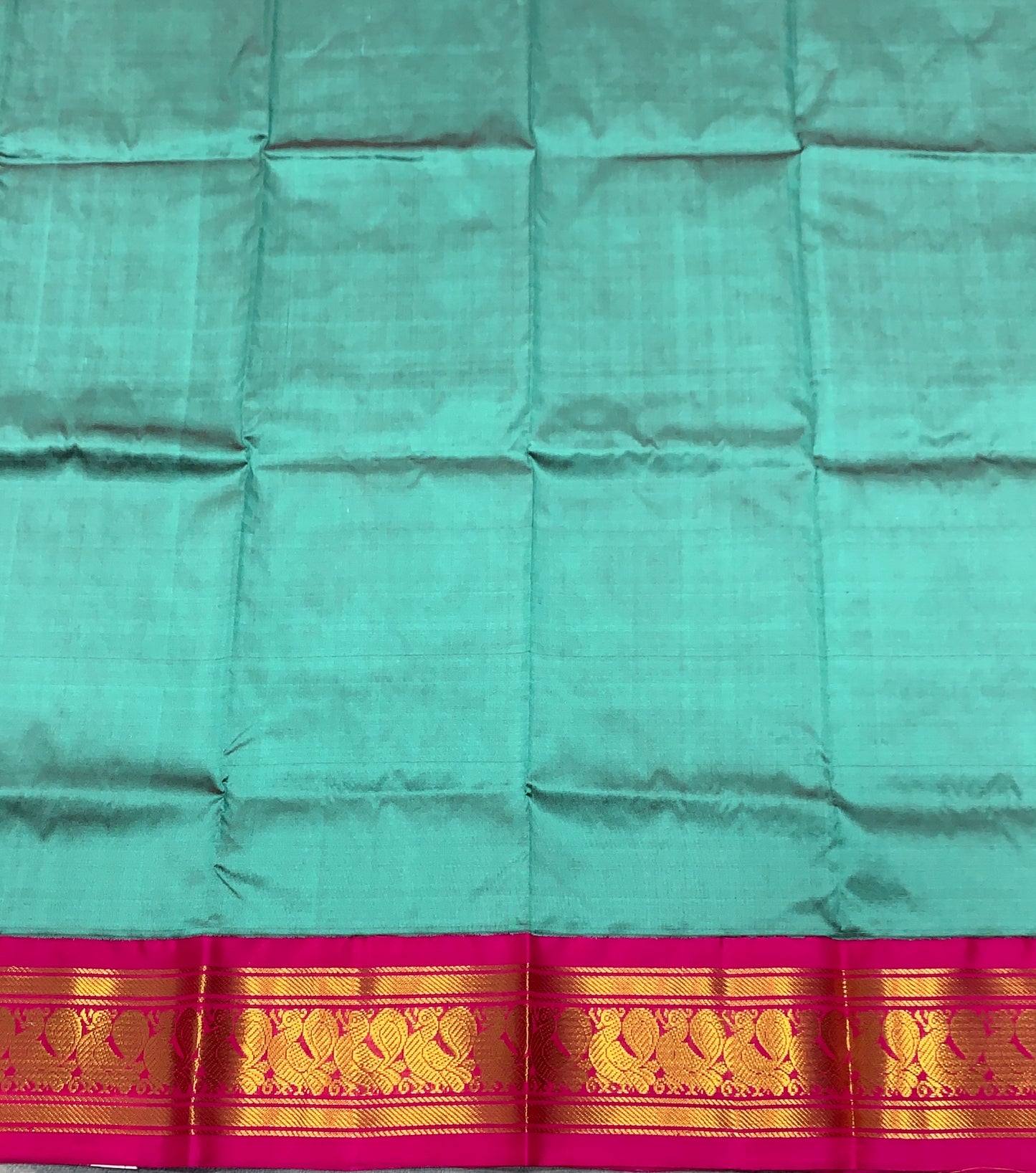 Dark Rama Green Shade Pure Kanchipuram Kids Pattu Pavadai with Contrast Border for Newborn to 2 Years