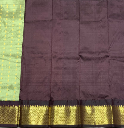 Pista Green Shade Pure Kanchipuram Kids Pattu Pavadai with Contrast Border for Newborn to 2 Years