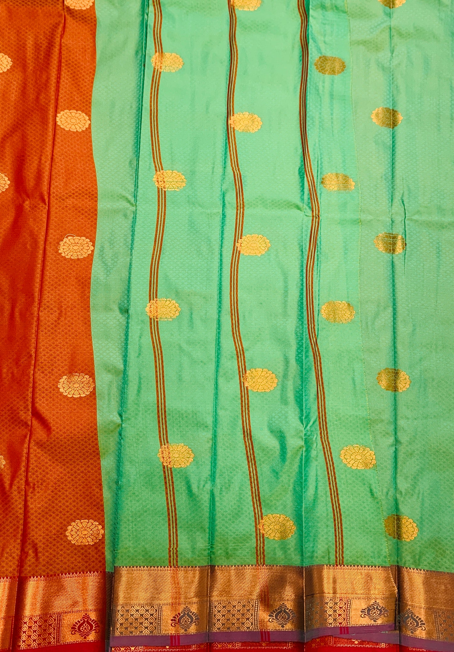 Brownish Orange Shade Silk Cotton Saree with Copper Zari Border and Floral Design