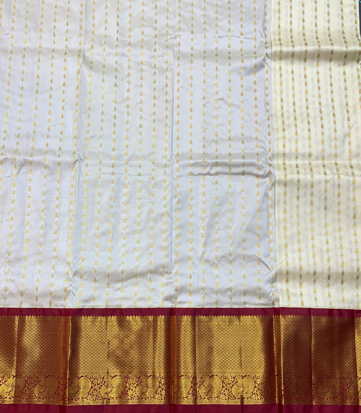 Ivory Shade Pure Kanchipuram Kids Pattu Pavadai with Contrast Border for age 5 to 10
