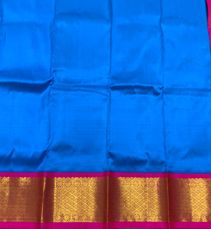 Sky Blue Shade Pure Kanchipuram Kids Pattu Pavadai with Contrast Border for Newborn to 2 Years