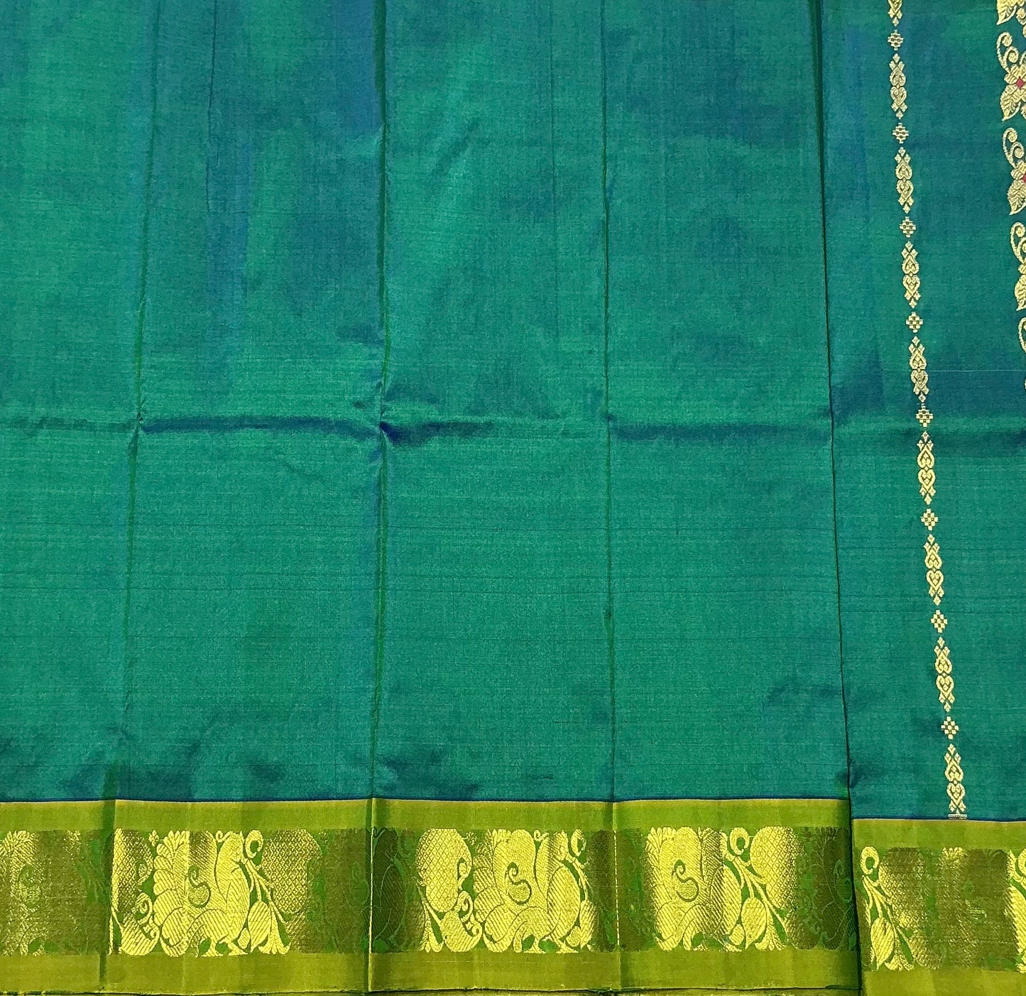 Green Shade Pure Kanchipuram Kids Pattu Pavadai with Contrast Border for Newborn to 2 Years