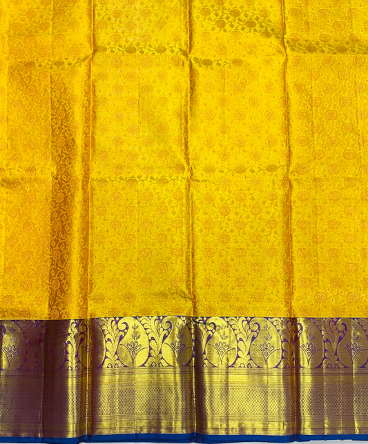 Yellow shade Pure Kanchipuram Kids Pattu Pavadai with contrast border for age 5 to 10