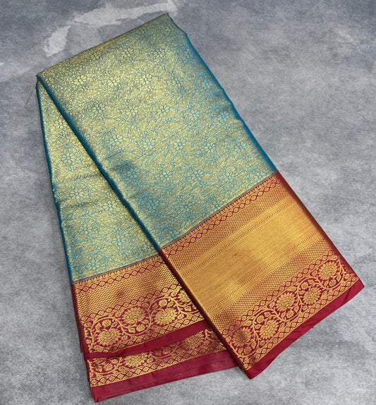 Fancy Tissue Saree Bluish Green Colour with Red Colour Floral Design Border