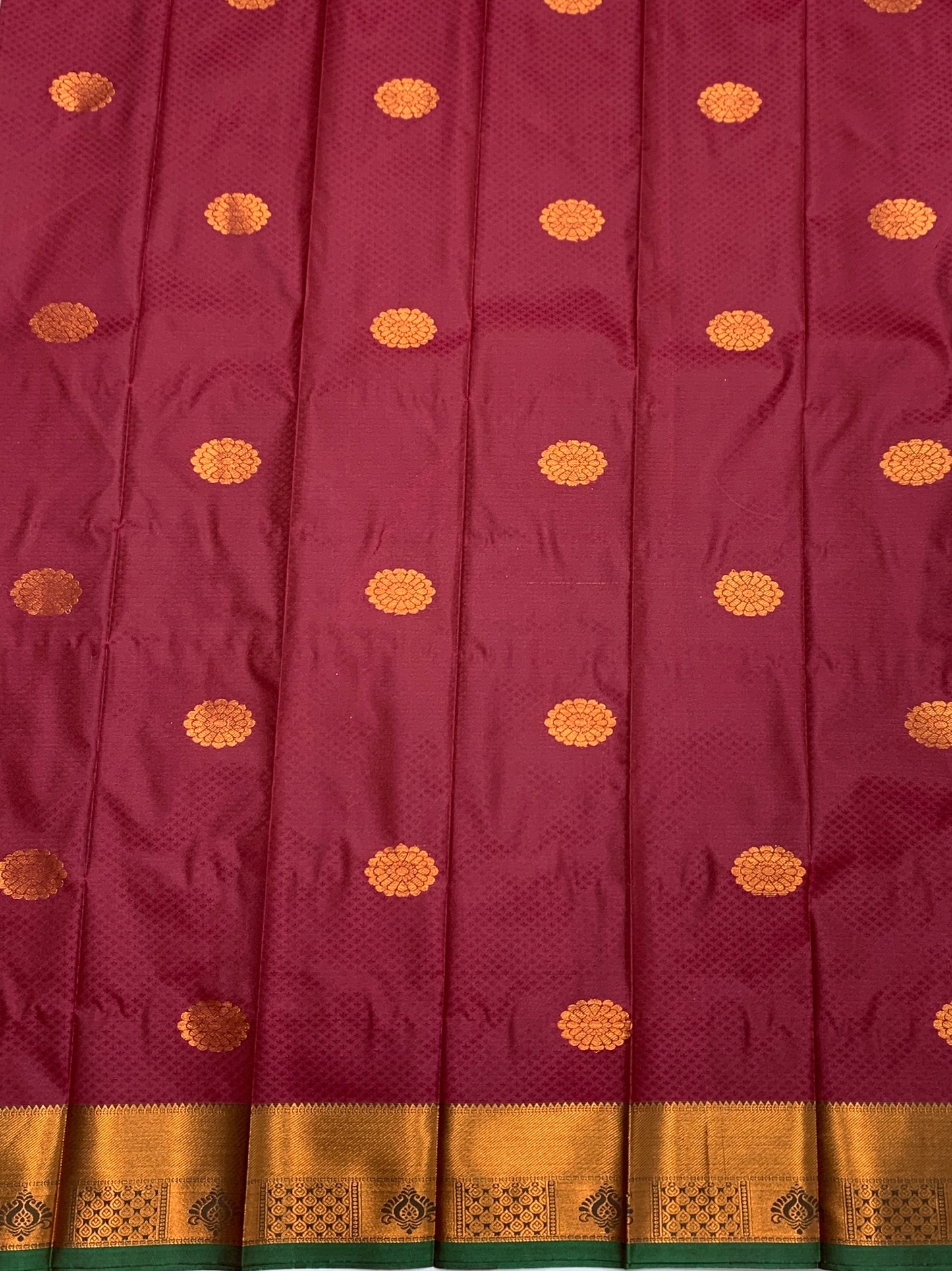 Maroon Shade Silk Cotton Saree with Copper Zari Border and Floral Design