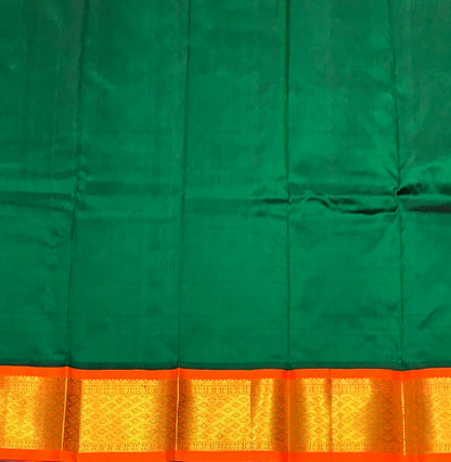 Green Shade Pure kanchipuram Kids Pattu Pavadai with Contrast Border for Newborn to 2 Years