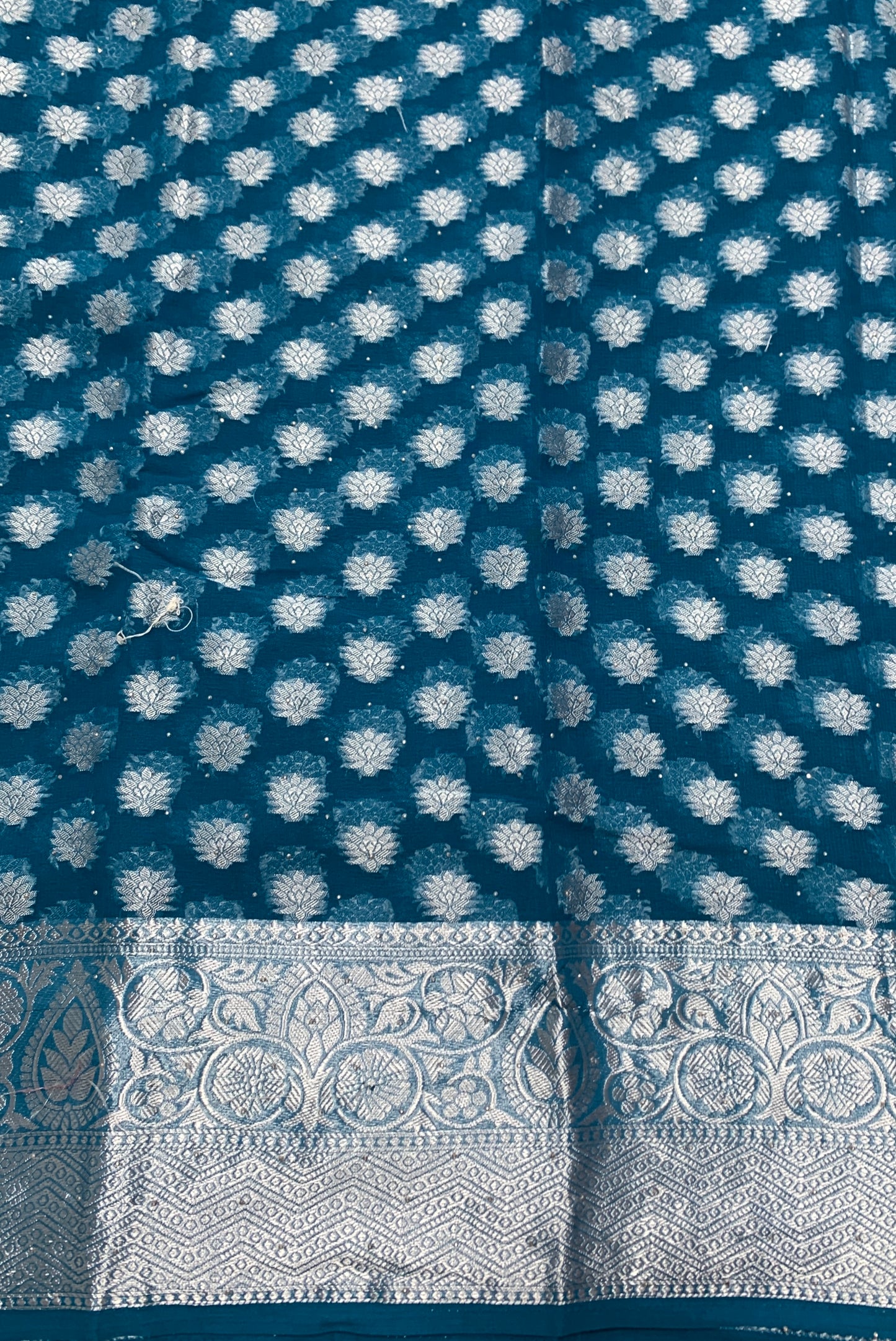 Georgette Saree Peacock Blue Colour with Sliver Floral Design Border