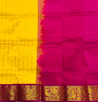 Yellow shade Pure kanchipuram Kids Pattu Pavadai with contrast border for newborn to 2 Years