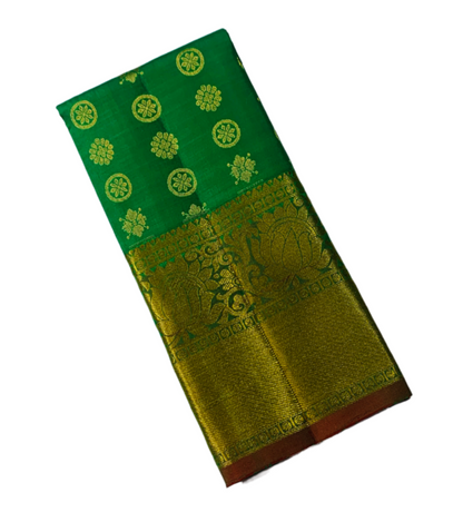 Green shade Pure kanchipuram Kids Pattu Pavadai with Golden border for newborn to 2