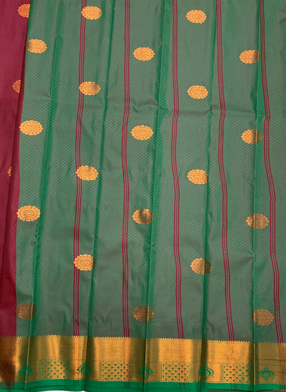 Maroon Shade Silk Cotton Saree with Copper Zari Border and Floral Design