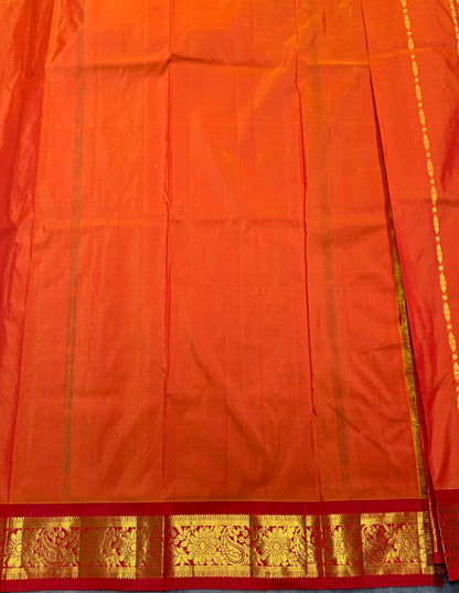 Orange shade Semi Silk Kids Pattu Pavadai with Contrast border for age above 10 years