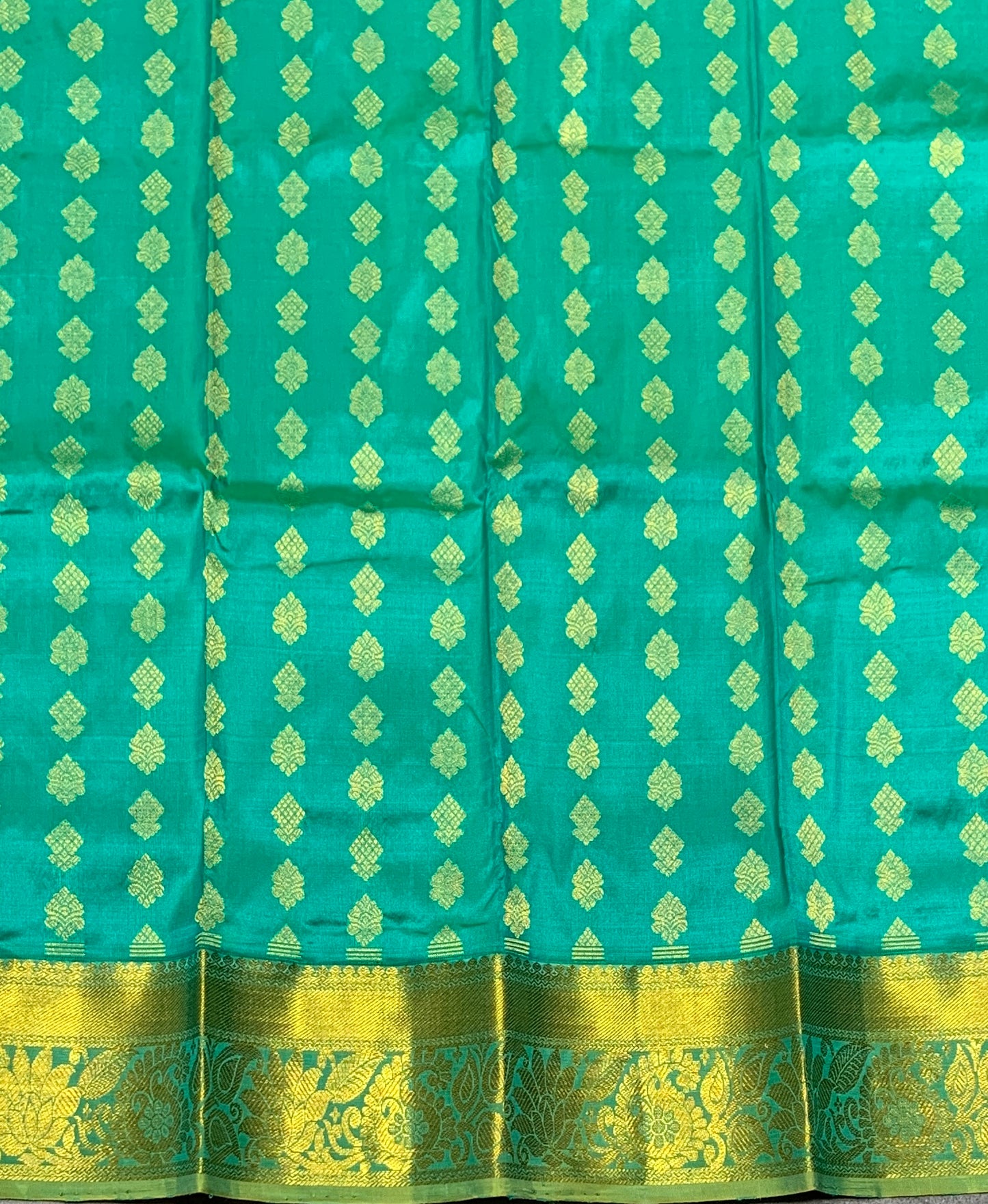 Rama Green Shade Pure Kanchipuram Kids Pattu Pavadai with Contrast Border for Newborn to 2 Years