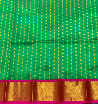 Light Green Shade Pure Kanchipuram Kids Pattu Pavadai with Contrast Border for Newborn to 2 Years