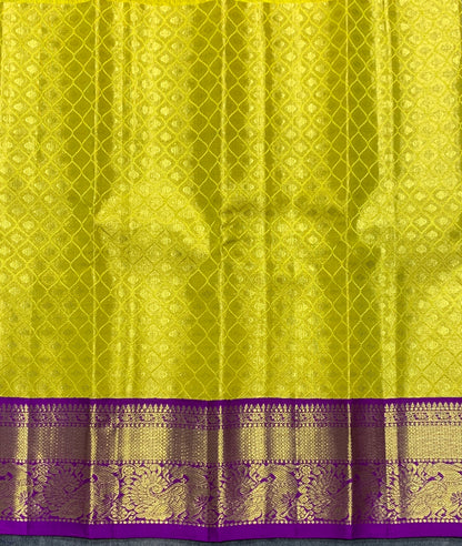 Yellow Shade Pure Kanchipuram Kids Pattu Pavadai with Contrast Border for Newborn to 2 Years