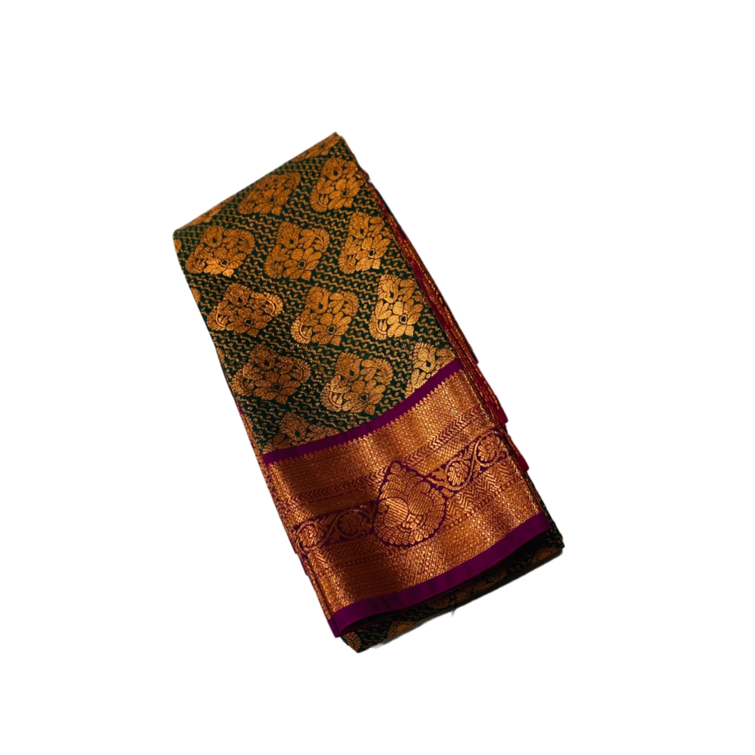 Bottle Green shade Soft kanchi pattu with Copper and Purple Border.