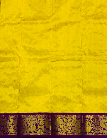 Yellow shade Pure kanchipuram Kids Pattu Pavadai with contrast border for newborn to 2 Years