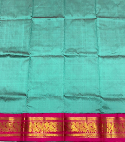 Dark Rama Green Shade Pure Kanchipuram Kids Pattu Pavadai with Contrast Border for Newborn to 2 Years