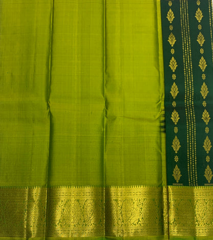 Green shade Pure kanchipuram Kids Pattu Pavadai with contrast border for newborn to 2 Years