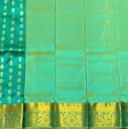 Rama Green Shade Pure Kanchipuram Kids Pattu Pavadai with Contrast Border for Newborn to 2 Years