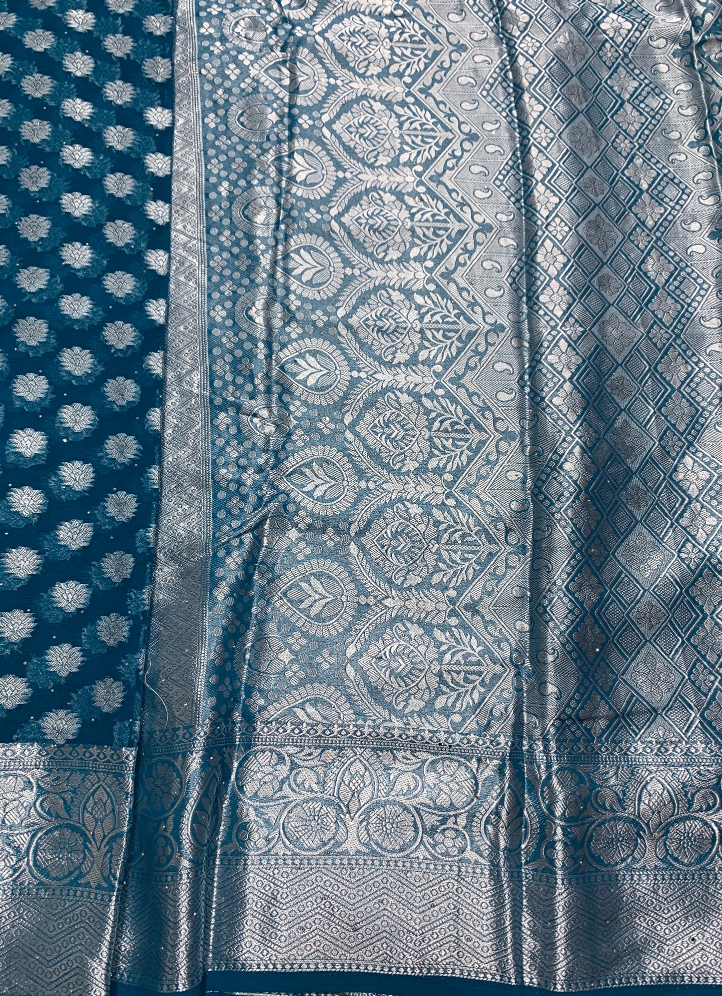 Georgette Saree Peacock Blue Colour with Sliver Floral Design Border