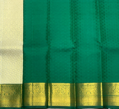 Ivory Shade Pure Kanchipuram Kids Pattu Pavadai with Contrast Border for Newborn to 2 Years