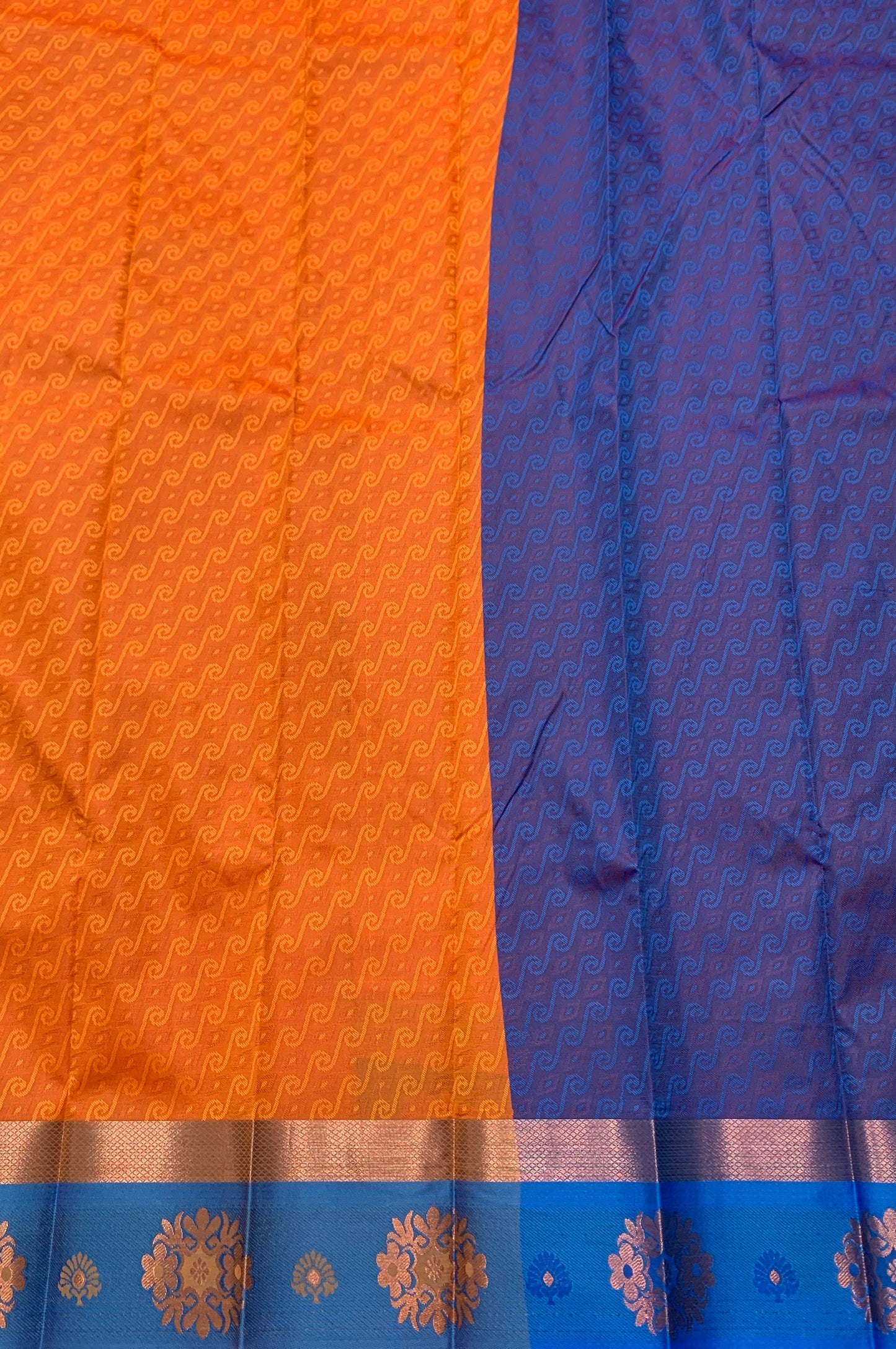 Synthetic Cotton Saree Orange Shade with Sky Blue Border and Floral Design