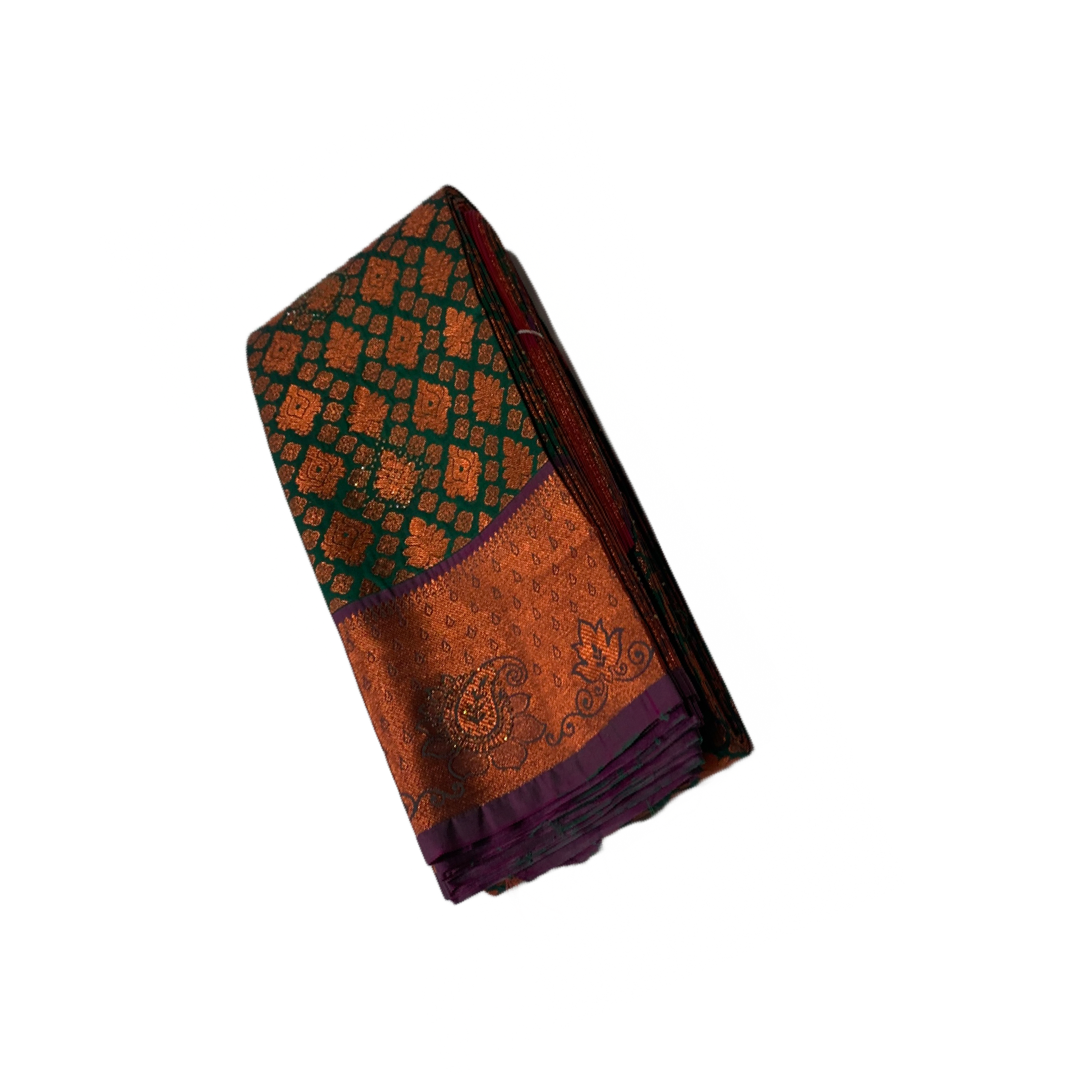 Green Soft kanchi pattu with Copper and Purple Border.