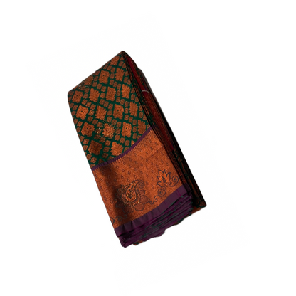 Green Soft kanchi pattu with Copper and Purple Border.