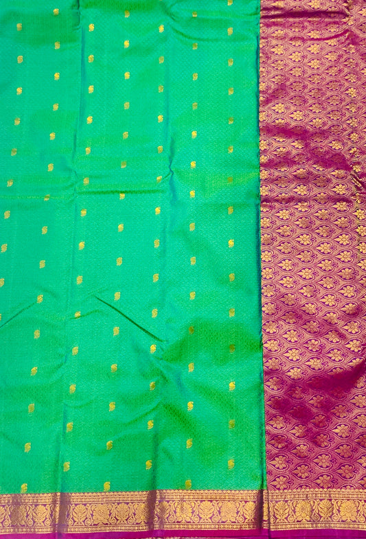 Green shade Semi Silk Saree with Pink Border with Flower Design