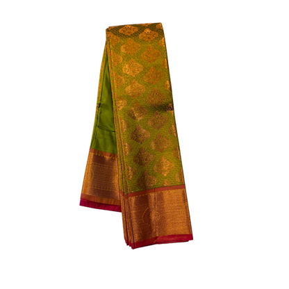 Maghndi Green shade Soft kanchi pattu with Copper Border.