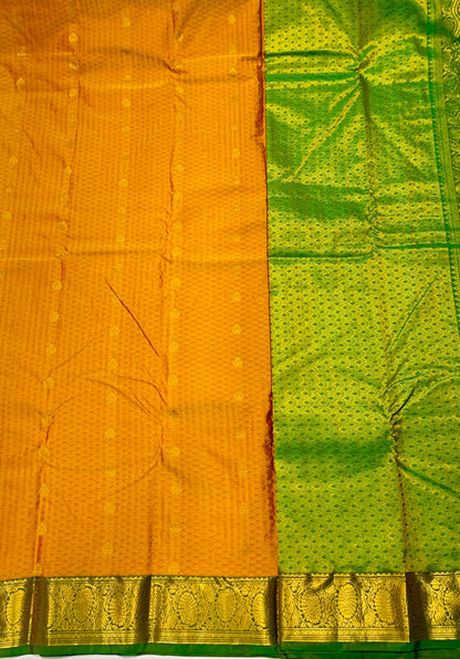 Mustard shade Semi Silk Saree with Green Border with Floral Design