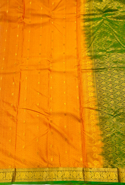 Mango Yellow shade Semi Silk Saree with Green Border with Flower Design