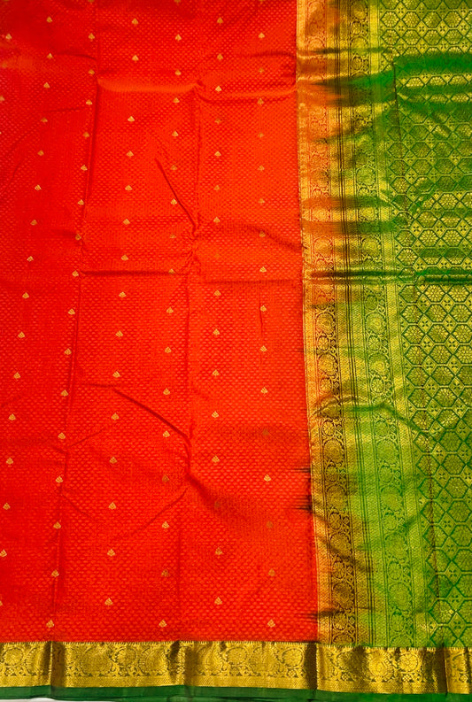 Orange shade Semi Silk Saree with Green Border with Mango and Flower Design