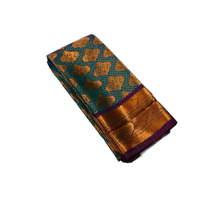 Peacock Blue shade Soft kanchi pattu with Copper and Purple Border.