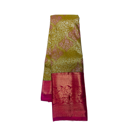 Olive Green shade Soft kanchi pattu with Pink Border.