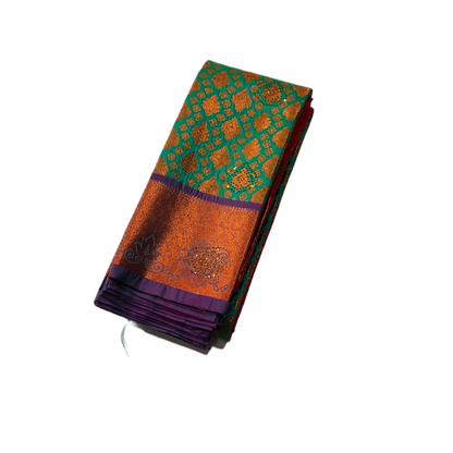 Ramar Green Soft kanchi pattu with Copper and Purple Border.