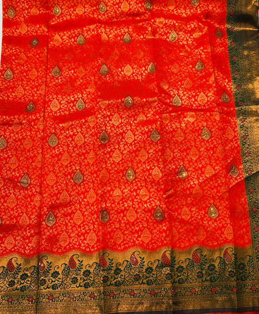 Red shade with Unstitched blouse in Aari work.