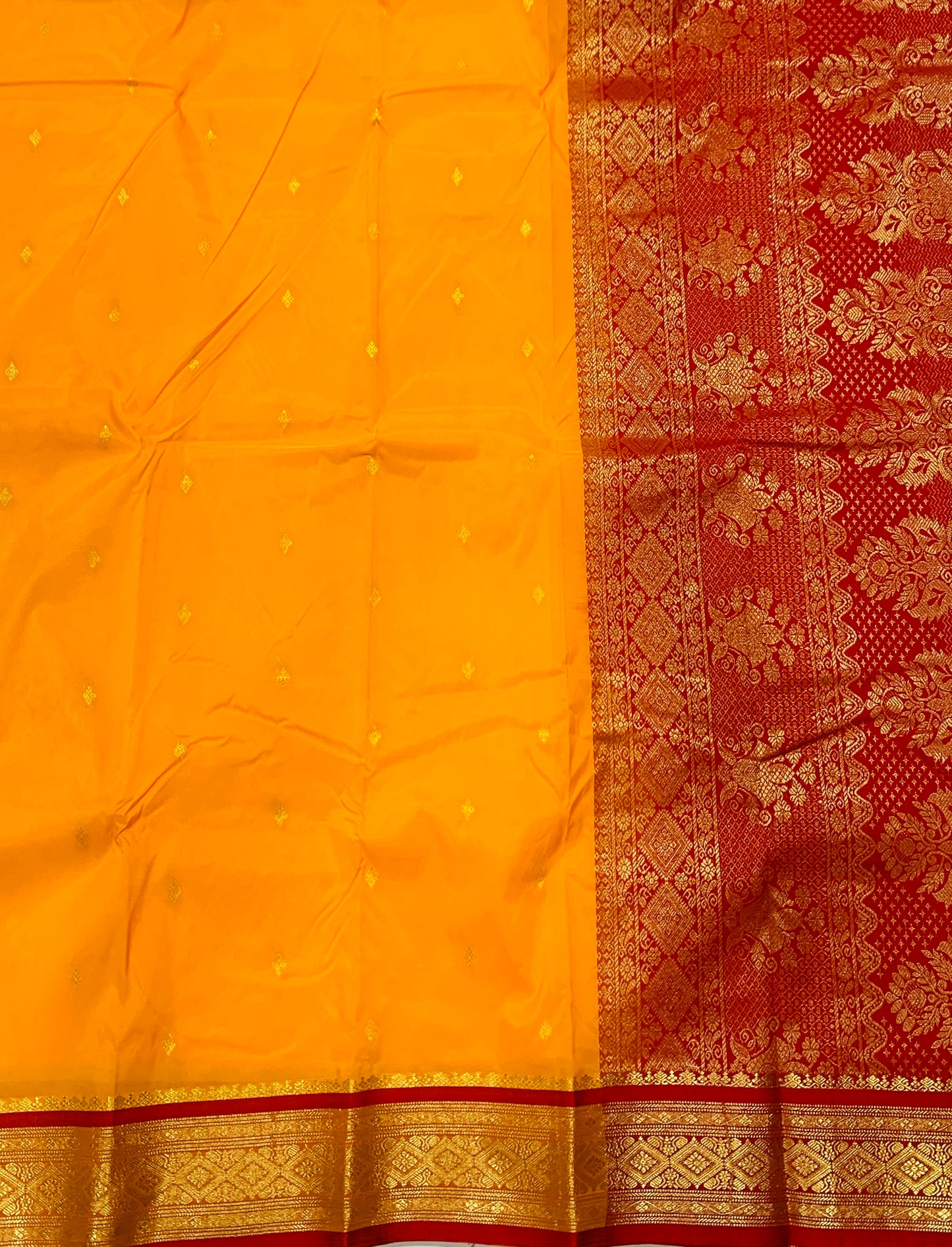 Yellow shade saree with Golden and Red Border