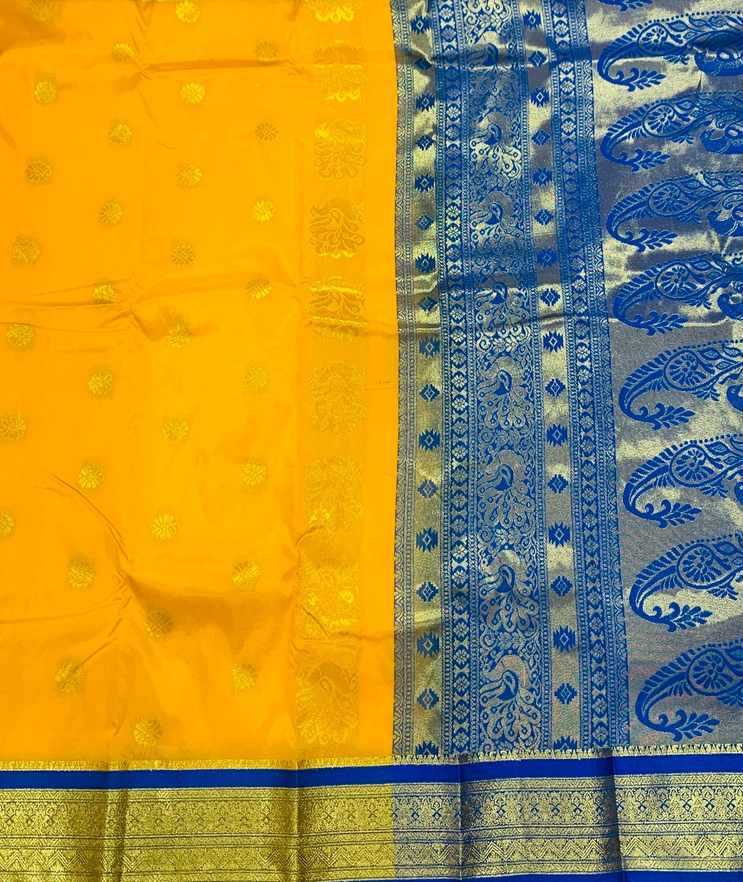 Yellow shade saree with Golden and Blue Border